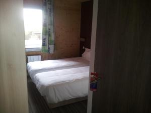 Postel nebo postele na pokoji v ubytování Fasthotel Dunkerque