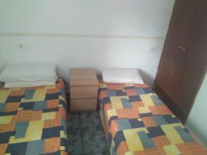 A bed or beds in a room at Apartament Cala llobeta, primera línia de mar
