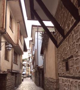 an alley in an old town with buildings at Sofia Apartment in Ohrid