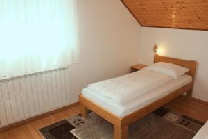 Postel nebo postele na pokoji v ubytování Apartments Jančić