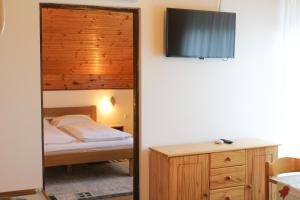 a bedroom with a bunk bed and a mirror at Apartments Jančić in Grabovac