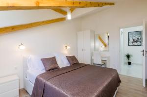 Posteľ alebo postele v izbe v ubytovaní Apartments Pavle