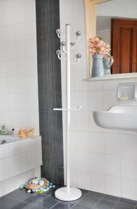 a shower in a bathroom with a sink and a mirror at Villa Avly in Maleme