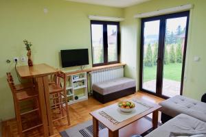 TV a/nebo společenská místnost v ubytování Apartments Milic