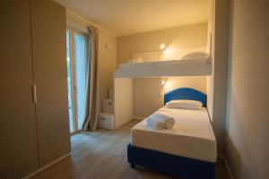 Двухъярусная кровать или двухъярусные кровати в номере Italianflat - Maison du Lac