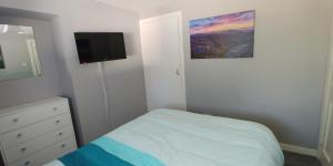 Ένα ή περισσότερα κρεβάτια σε δωμάτιο στο Brae Cottage, Inverness