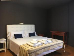 Ένα ή περισσότερα κρεβάτια σε δωμάτιο στο Hostal IMAGINATELO