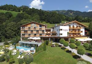 an aerial view of a hotel with a pool at Sport-Wellnesshotel Bichlhof in Kitzbühel