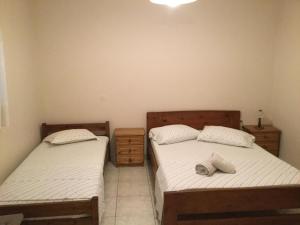 Postel nebo postele na pokoji v ubytování ntinas house