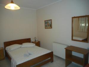 Postel nebo postele na pokoji v ubytování ntinas house