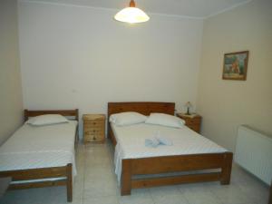 Postel nebo postele na pokoji v ubytování ntinas house