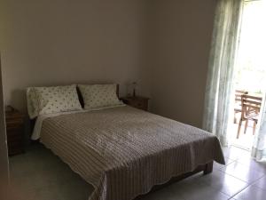 Postel nebo postele na pokoji v ubytování ntinas house