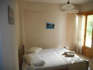 Postel nebo postele na pokoji v ubytování ntinas house