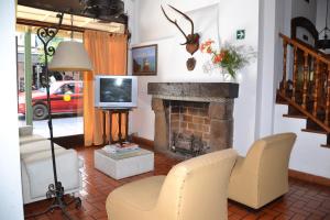 Телевизор и/или развлекательный центр в Hotel Regidor