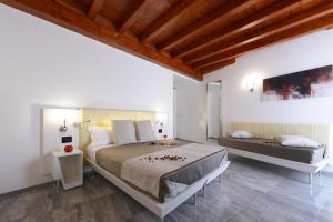 a bedroom with two beds in a room at Best Western Hotel Principe di Lampedusa in Palermo