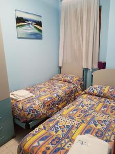 Cama ou camas em um quarto em Casa Melania