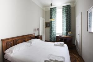 A bed or beds in a room at Villa Martelli