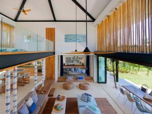 an open living room with a large glass wall at Villa Seascape by Elite Havens in Nusa Lembongan