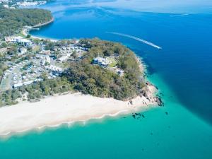 an aerial view of an island in the ocean at Halifax Holiday Park in Nelson Bay