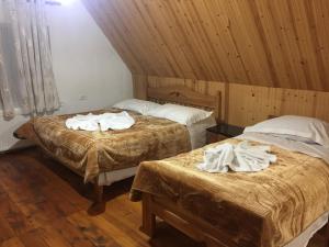 Postel nebo postele na pokoji v ubytování Guesthouse Alpini