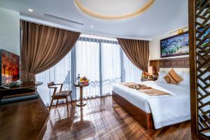 Postel nebo postele na pokoji v ubytování Sapa Relax Hotel & Spa