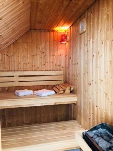 a wooden sauna with two beds in it at Waldhaus Oelper in Braunschweig