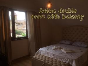 Postel nebo postele na pokoji v ubytování Hotel Bagineti