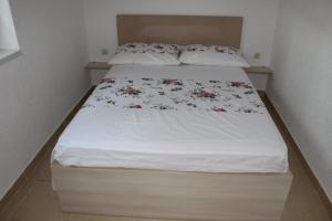 Ein Bett oder Betten in einem Zimmer der Unterkunft Vila Apartment