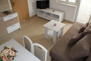 Ein Sitzbereich in der Unterkunft Vila Apartment