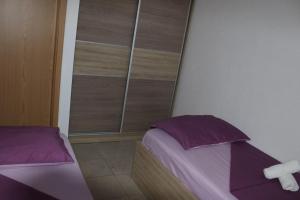 Ein Bett oder Betten in einem Zimmer der Unterkunft Vila Apartment