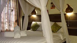 מיטה או מיטות בחדר ב-Osoita Lodge