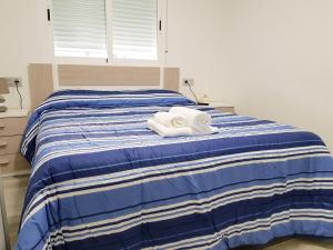 Postel nebo postele na pokoji v ubytování Apartamento Completo Plaza España + 27 fotografií
