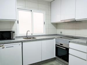 Kuchyň nebo kuchyňský kout v ubytování Apartamento Completo Plaza España