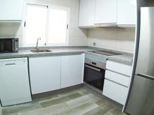 Kuchyň nebo kuchyňský kout v ubytování Apartamento Completo Plaza España