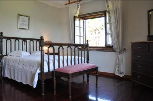 a bedroom with a bed and a window at Quintinha d´Avó in Vila de Prado +102 photos