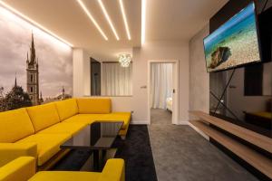 TV a/nebo společenská místnost v ubytování Hotel Grand