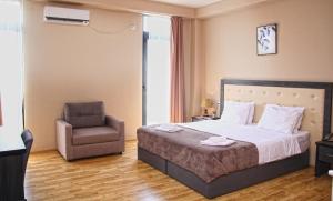A bed or beds in a room at Rogalux Blue