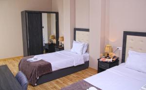 A bed or beds in a room at Rogalux Blue