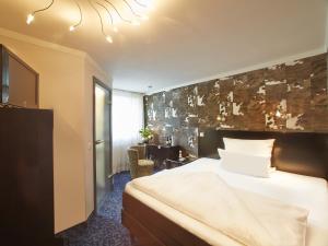 Postel nebo postele na pokoji v ubytování Top Hotel Krämer