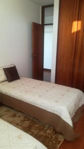 מיטה או מיטות בחדר ב-Casa da Malta- Só para famílias