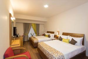 Ένα ή περισσότερα κρεβάτια σε δωμάτιο στο Meadows Residency