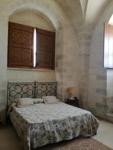 Кровать или кровати в номере Masseria Gattamora +37 фотографий