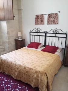 Un pat sau paturi într-o cameră la Masseria Gattamora