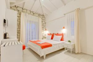 Giường trong phòng chung tại ALAÇATI VİLLAPERİ BUTiK OTEL