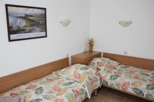 Postel nebo postele na pokoji v ubytování Hotel Radik