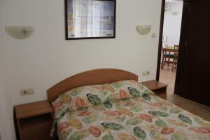 Postel nebo postele na pokoji v ubytování Hotel Radik