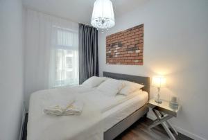 Posteľ alebo postele v izbe v ubytovaní Funkcjonalne i Komfortowe Apartamenty Sun Seasons 24 w Kołobrzegu by Noclegi Renters