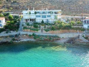 an aerial view of a house next to a body of water at Kiveri Luxurious Seaside Apartment in Kiveri