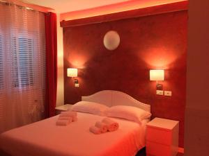Postel nebo postele na pokoji v ubytování Hotel Malpensafiera