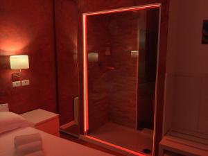 Postel nebo postele na pokoji v ubytování Hotel Malpensafiera